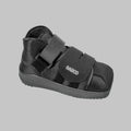 Black Darco post-op recovery shoe with velcro straps for foot rehabilitation and mobility support