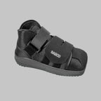 Black Darco post-op recovery shoe with velcro straps for foot rehabilitation and mobility support