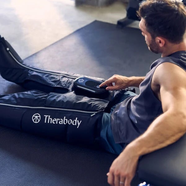 Therabody RecoveryAir JetBoots PRIME folded with backpack