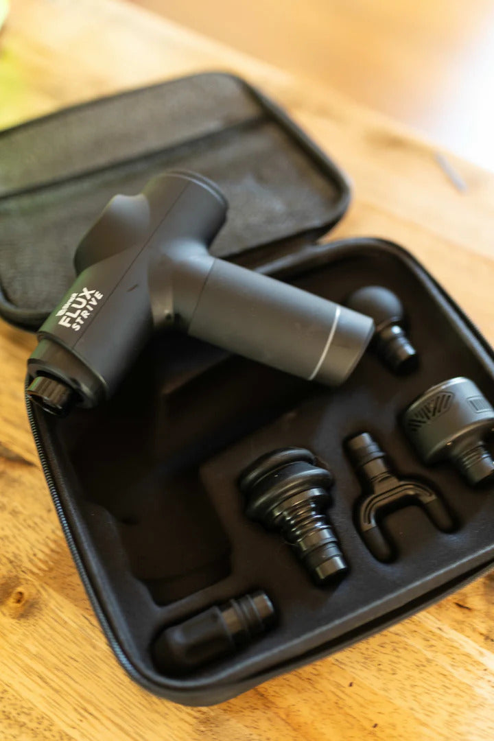 Strapit STRIVE massage gun with attachments